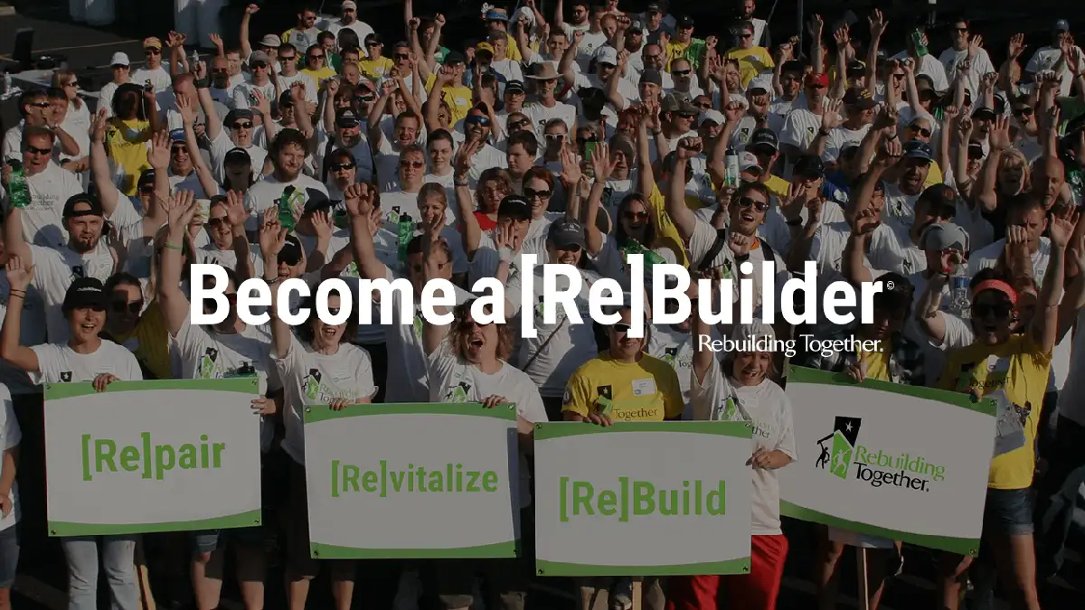 Rebuilding Together concept image, large group of volunteers marching in the background with the words "become a rebuilder" in the foreground - Southwest Illinois